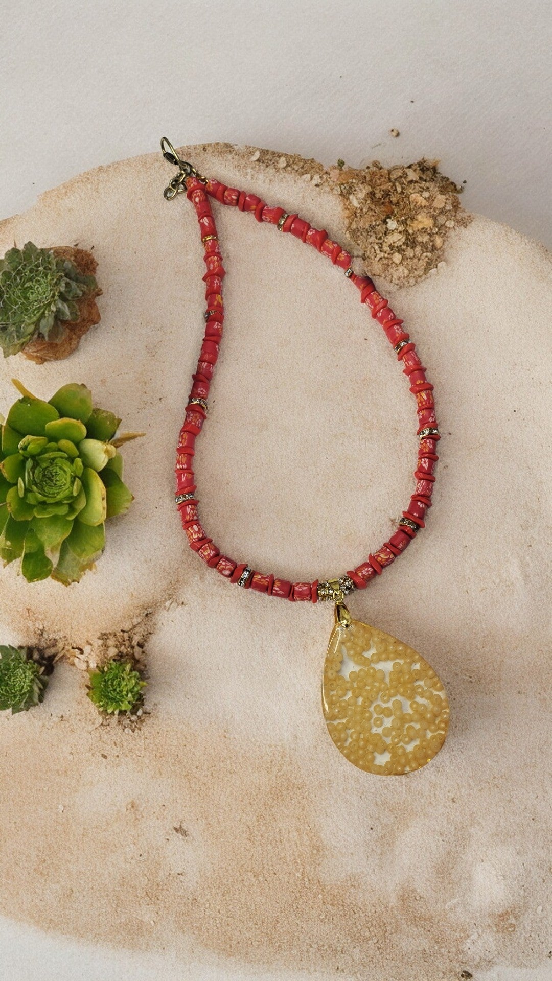 Red necklace with resin pendent